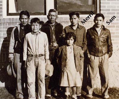 Merril and Samuel Sandoval were brothers and Navajo Code Talkers during World War II. They are pictured here with their father and siblings. Merril died in 2008 and Samuel died in 2022. (Photo source: www.navajo-codetalker.com)